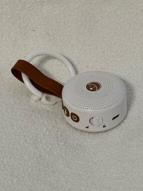 Portable White Bluetooth Speaker with Brown Strap sound